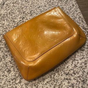 authentic Louis Vuitton clutch, a couple flaws